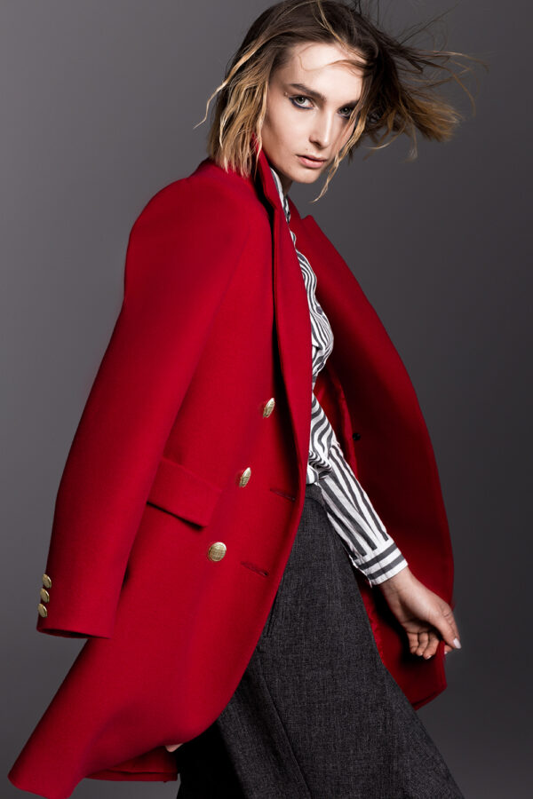 Red spring coat with gold fastening.